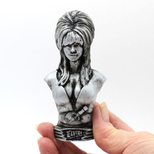 Elvira Mistress of the Dark, Famous Horror Hostess, Cassandra Peterson, Raven Hair that defies gravity, Beehive 1960s Hairdo Hairstyle